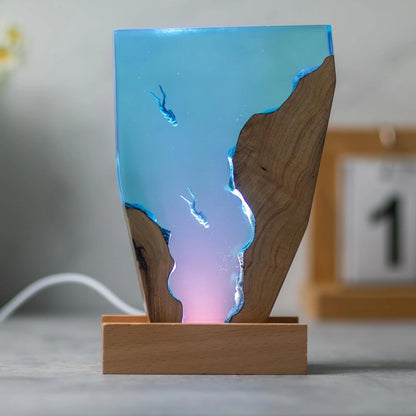 Double Dive epoxy resin night light on a wooden base with soft pink LED glow – Woodiny