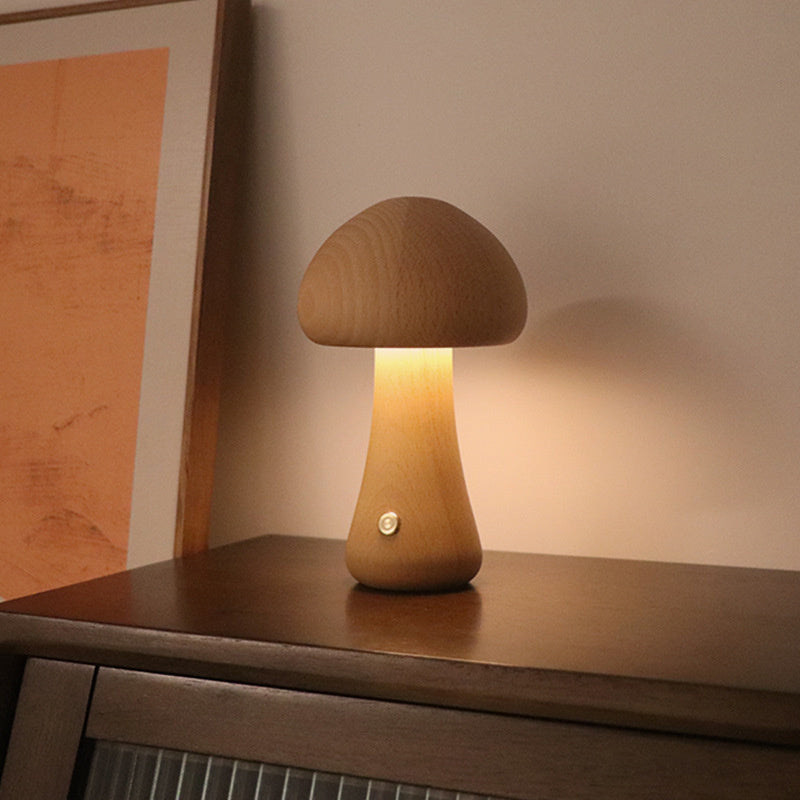 Light wood mushroom night lamp glowing on a dresser – Woodiny