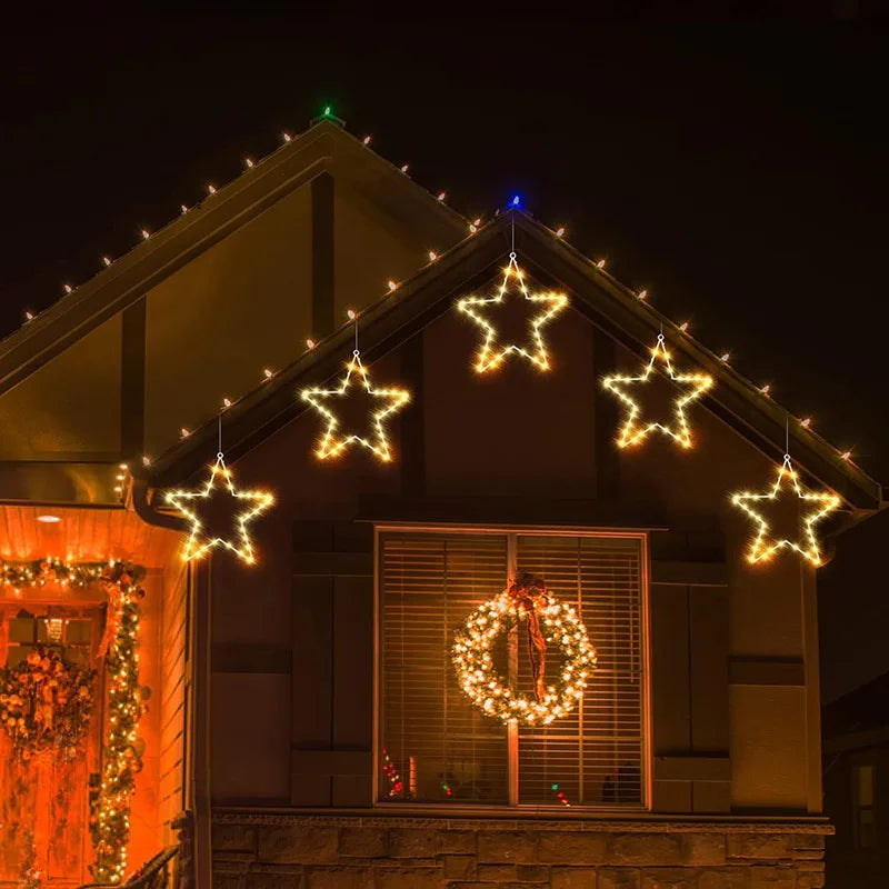 Several LED Christmas stars decorating a house facade