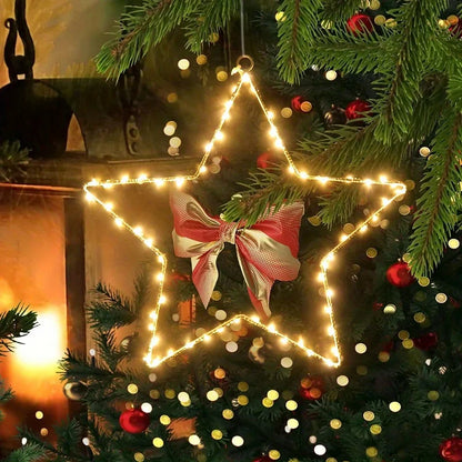 Warm white LED Christmas star with bow glowing on a Christmas tree – Woodiny