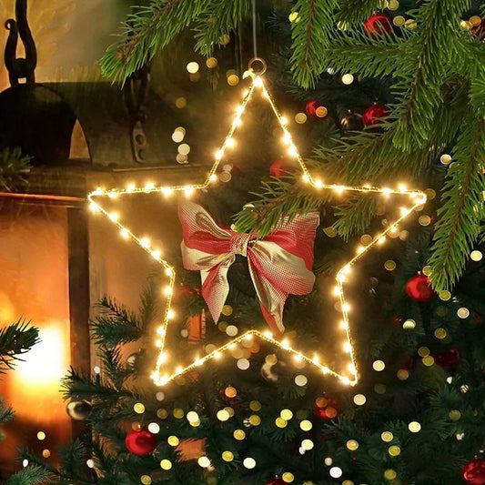 Warm white LED Christmas star with bow glowing on a Christmas tree – Woodiny