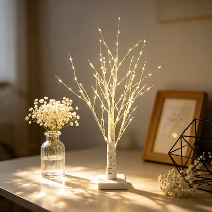 Warm white birch twig lamp on a side table