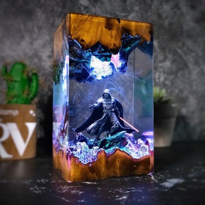 Lone Warrior resin lamp glowing blue and purple on a dark desk – Woodiny