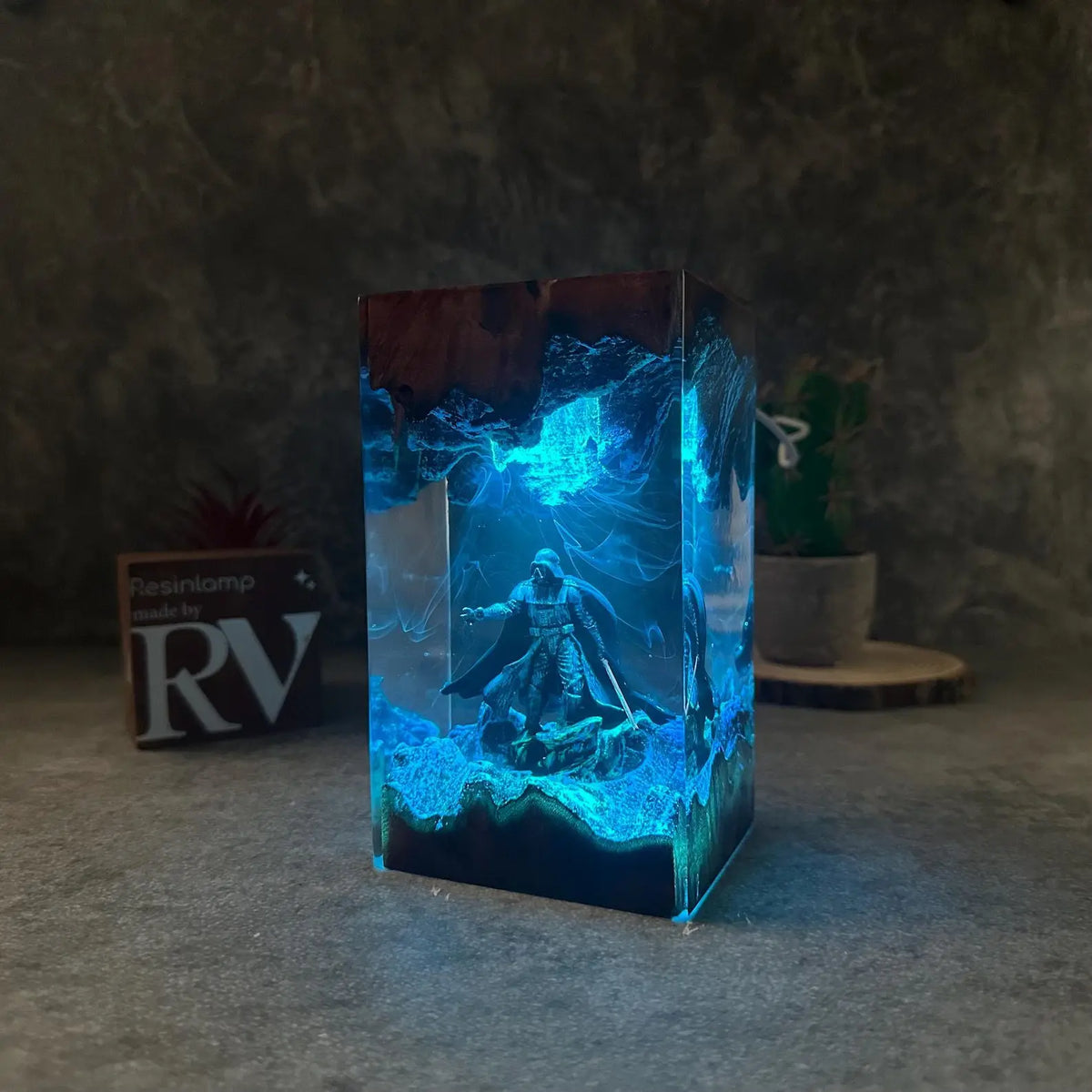 Lone Warrior resin lamp glowing ice blue in a dark room – Woodiny