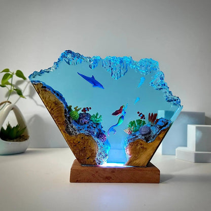 Handmade dolphin mermaid resin lamp lit up at night