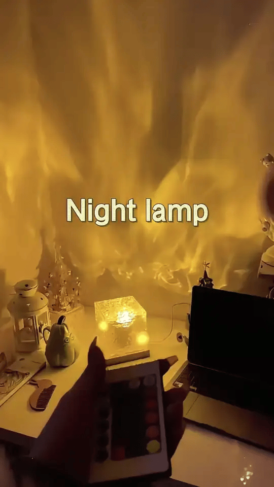 Ocean wave projector lamp filling a room with golden flame-like ripples – Woodiny